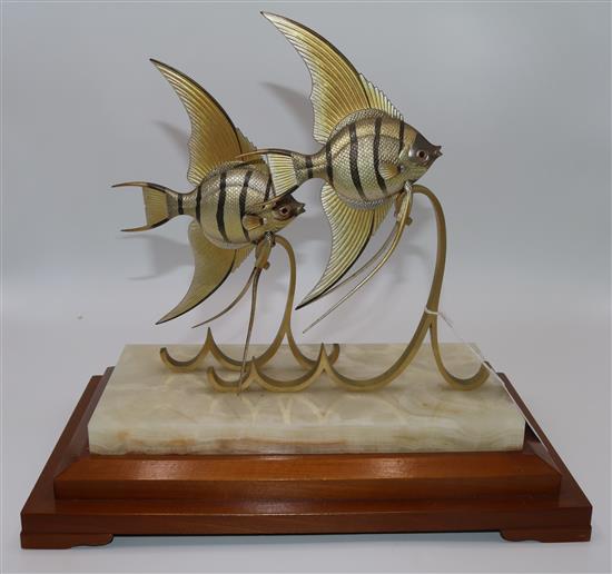 Takehiko. A pair of silver Angel Fish on gilt metal stylised waves, 9.25in.